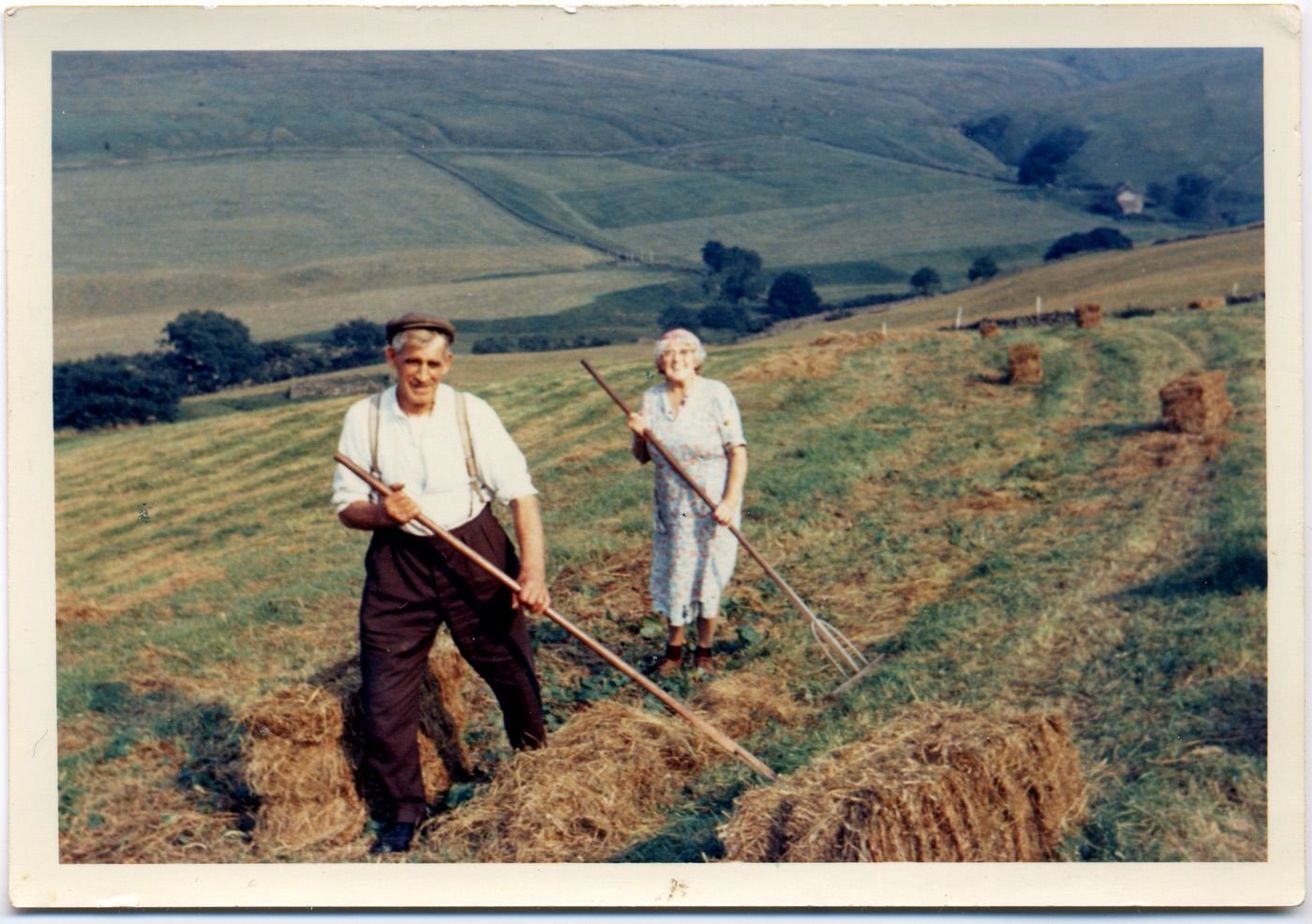 Coll. Margaret Bramwell, Valley View, Garrigill. T.381225
It looks as if the fogg's coming through a weathered crop of hay up Garrigill. The Bramwell family bought their first tractor, a grey Fergie, in 1952.
This photo marked, "Down the Long Years" 
2 canny folks.   from Herbert Spark, 1970.
Permission to use from Margaret Bramwell, 15 July 2004 . Shows Joe Herdman & Ruth Herdman, (married to George H.)